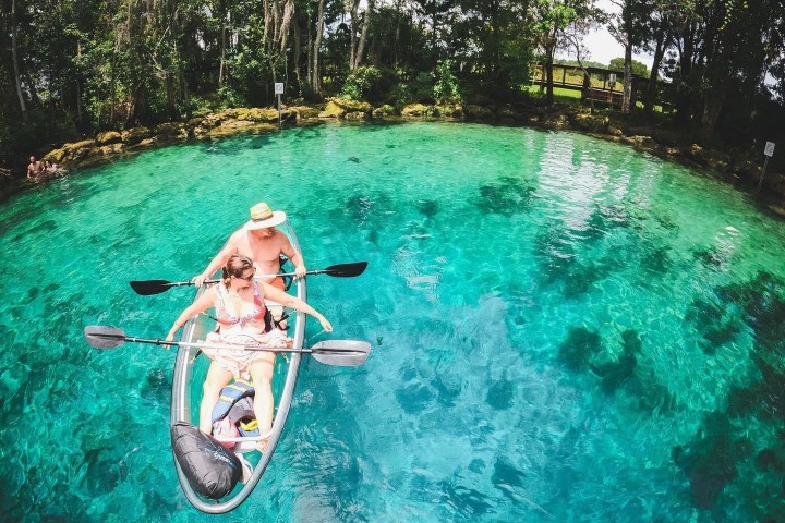 a person swimming in a pool of water