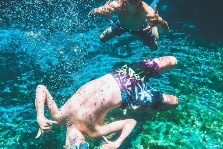 a man swimming in a pool of water