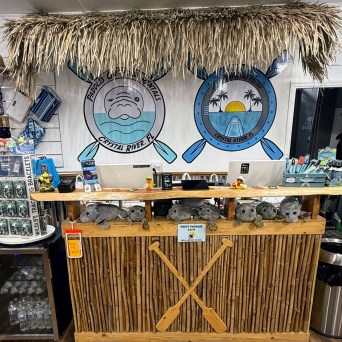 a clock on top of a wooden table